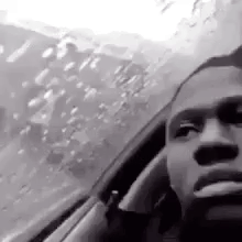 Black and White Man Smoking While Driving