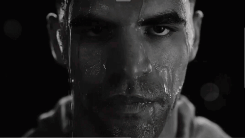 Black and White Man Spitting Water