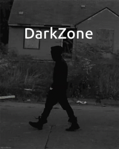 Black and White Man Standing in Front of Darkzone Building