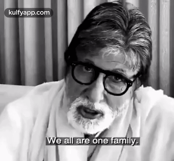 Black and White Man With Glasses and Beard Saying We All Are One Family
