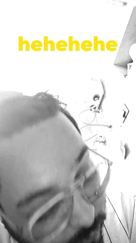 Black And White Man With Glasses And Yellow Henehene GIF