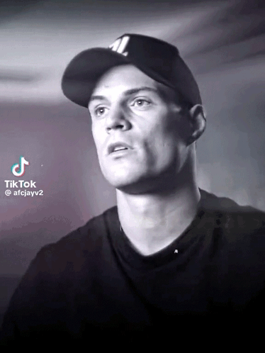 Black and White Man With JL Baseball Cap