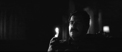 Black and White Man With Mustache Holding Lighter