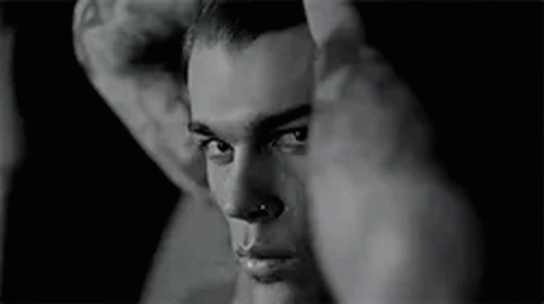 Black and White Man With Nose Ring and Face Tattoo