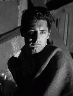 Black and White Man Wrapped in Blanket Smoking Cigarette