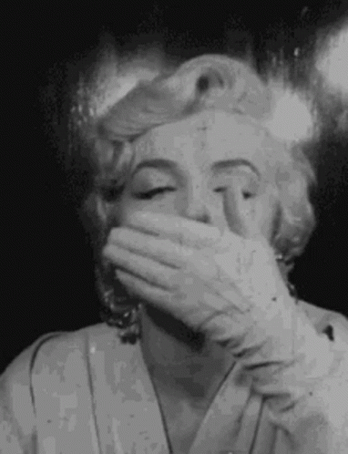 Black and White Marilyn Monroe Covering Mouth With Hand