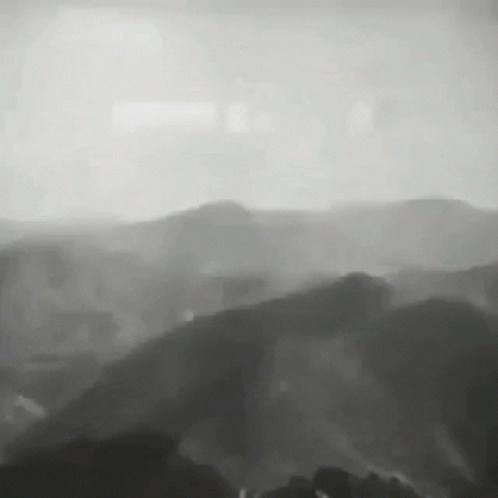 Black And White Mountain Range With Trees GIF