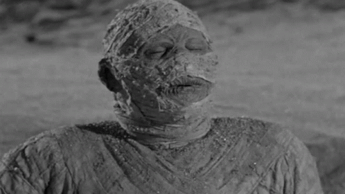 Black and White Mummy With Cigarette Mouth Open
