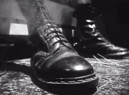 Black And White Person In Combat Boots GIF