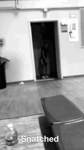 Black and White Person in Doorway Snatched