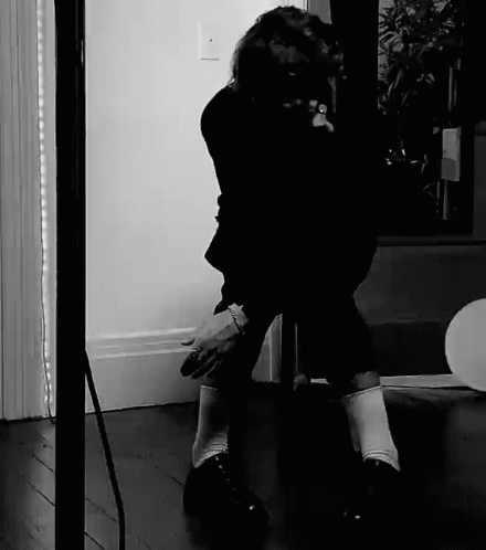 Black And White Person Kneeling GIF