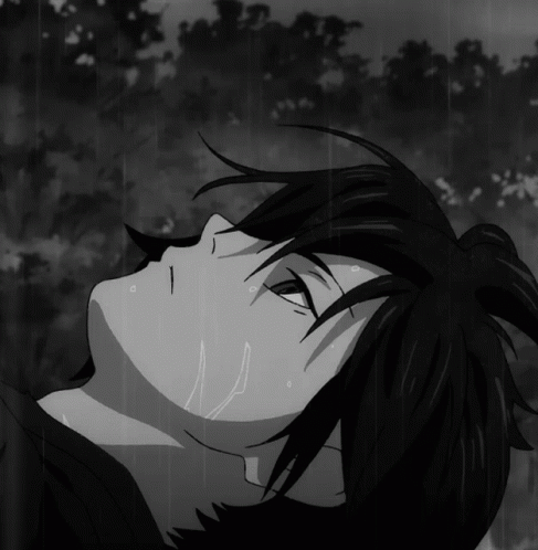 Black And White Person Laying In Rain GIF