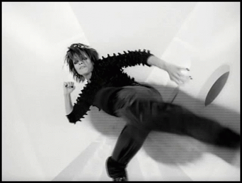 Black and White Person Laying on Ground