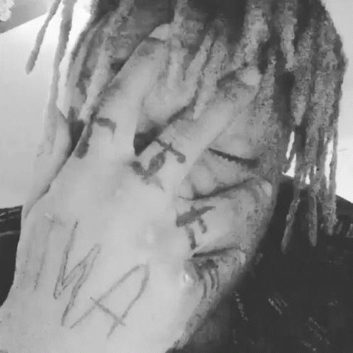 Black And White Person With Dreadlocks And Hand Tattoo GIF