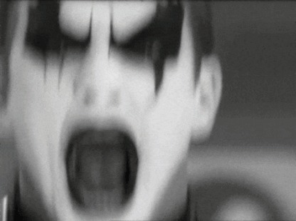 Black and White Person With Scary Face Painted