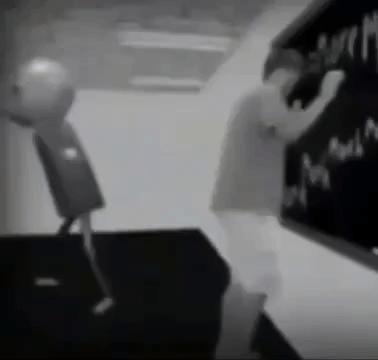 Black And White Person Writing On Blackboard GIF