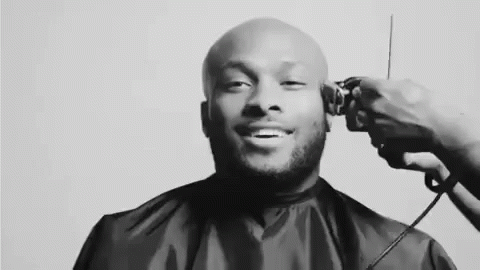 Black and White Photo Man Getting Haircut