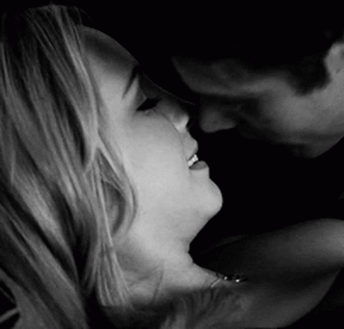 Black And White Photo Man Kissing Woman On Neck GIF