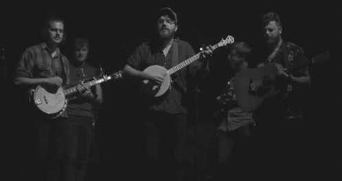 Black and White Photo of Band Playing Guitars