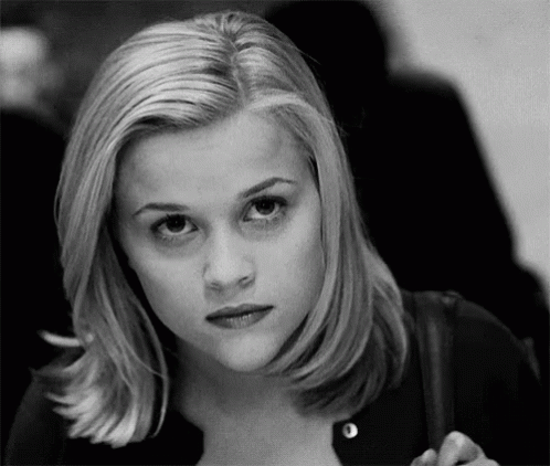 Black And White Photo Of Blonde Woman Looking At Camera GIF