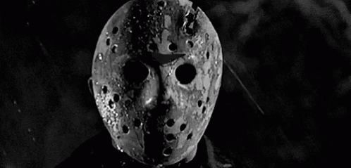 Black And White Photo Of Jason Voorhees Mask In Rain GIF