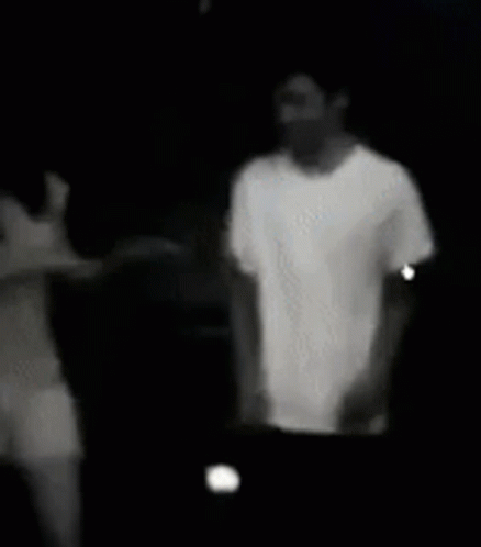 Black and White Photo of Man and Woman Holding Hands