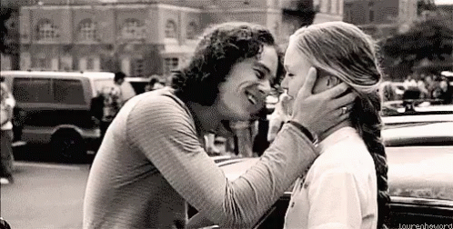 Black and White Photo of Man and Woman Kissing