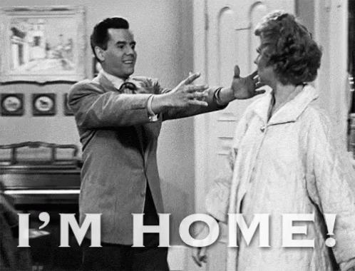 Black And White Photo Of Man And Woman Saying I'm Home GIF