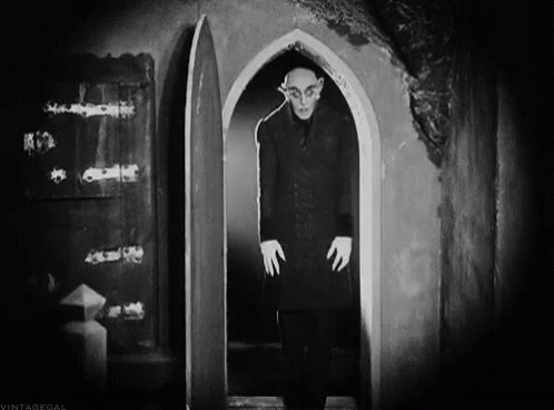 Black And White Photo Of Man In Doorway GIF