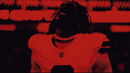 Black and White Photo of Man in NFL Jersey
