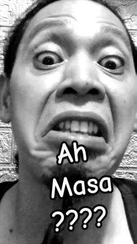 Black and White Photo of Man Making Funny Face With Words Ah Masa