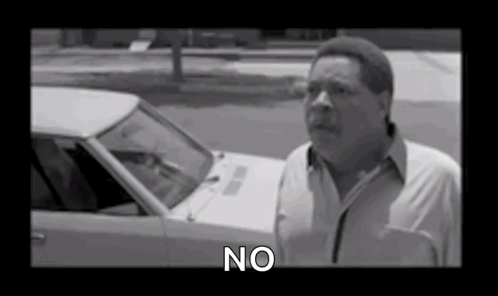Black And White Photo Of Man Saying No In Front Of Car GIF