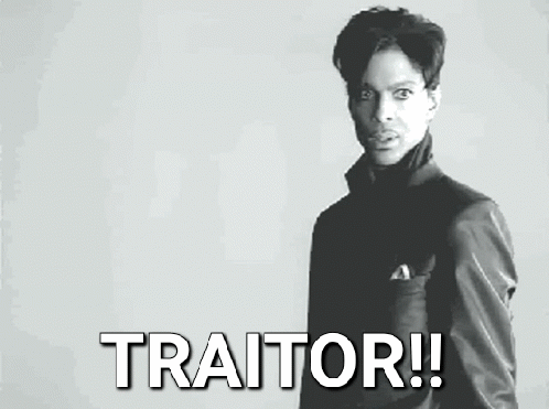 Black and White Photo of Man Saying Traitor