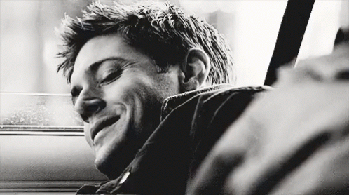 Black And White Photo Of Man Smiling In Car GIF