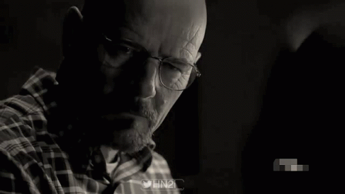 Black and White Photo of Man Wearing Glasses