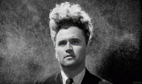 Black and White Photo of Man With White Hair