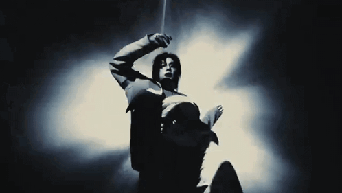 Black And White Photo Of Person In Suit GIF