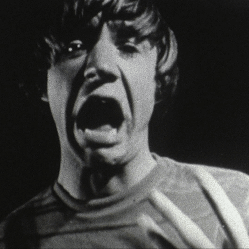 Black and White Photo of Person Mouth Wide Open
