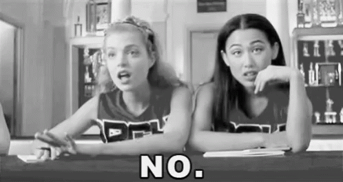 Black And White Photo Of Two Cheerleaders Saying No GIF