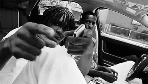 Black And White Photo Of Two Men In A Car GIF