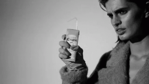 Black and White Photo of Woman Holding Juice Box