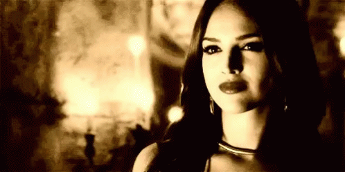 Black And White Photo Of Woman In Dark Room GIF