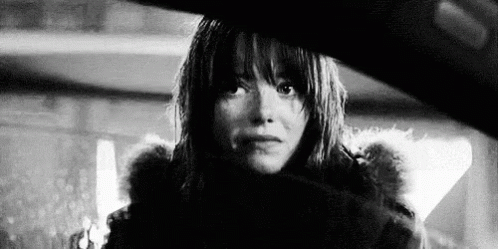Black and White Photo of Woman in Fur Coat and Fur Hood