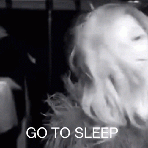 Black And White Photo Of Woman Saying Go To Sleep GIF