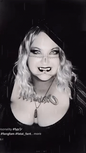 Black and White Photo of Woman With Fatal Fant Necklace