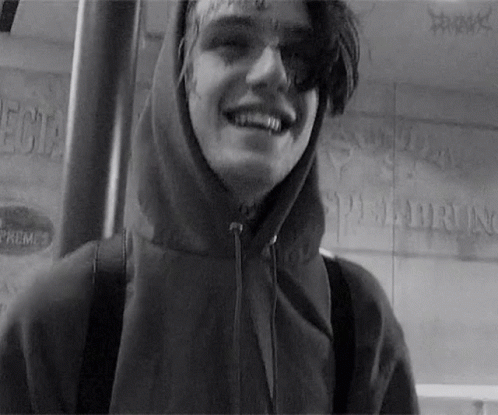 Black and White Photo of Young Man in Hoodie