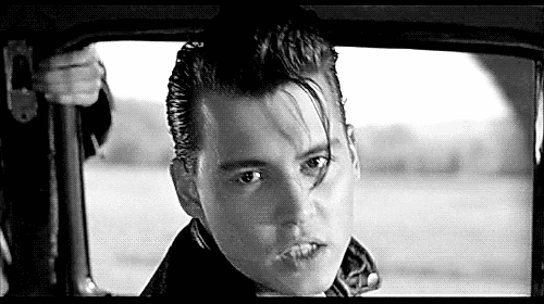 Black And White Photo Of Young Man Sitting In Car GIF