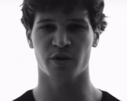 Black and White Photo of Young Man