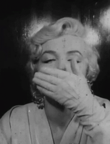 Black and White Photo Woman Covering Mouth