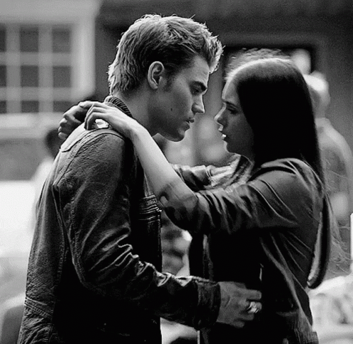 Black and White Photo Woman Hugging Man